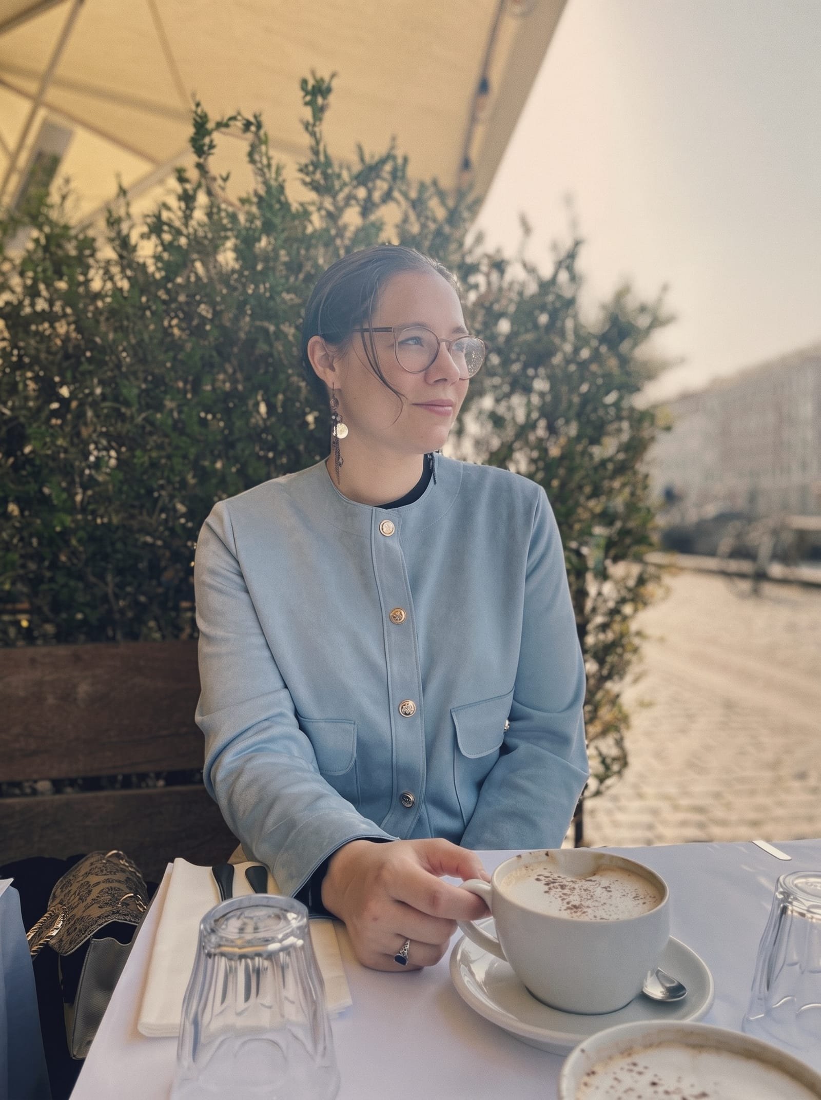Noemi Debellis at a café table in Zurich